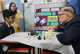 Education Minister Kalla play chess