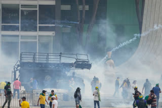 Protesters, supporters of former President Jair Bolsonaro, clashed with police during a protest outside the Planalto Palace building in Brasilia, Brazil, Sunday, Jan. 8, 2023. Other demonstrators stormed congress and the Supreme Court.