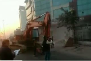 Bulldozers are pressed into service by the Jaipur Development Authority on the buildings of the prime suspects in the  Rajasthan Public Service Commission (RPSC) paper leak case.