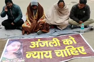 Anjali family sitting in front of police station