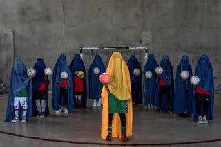 Girls posed for an AP photographer for portraits with the sports equipment they loved by hiding their identities in fear of attracting Taliban harshness.