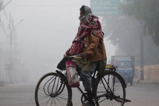 A man cycling in winter