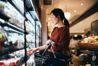 woman carrying a shopping basket