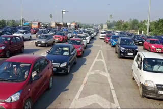 Vehicles lined up at toll gates