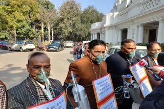 MLAs arrived in assembly wearing oxygen mask