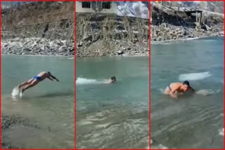 Two Boys Swimming In Minus 15 Degree Temperature