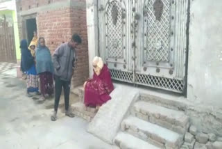 Girlfriend sitting at door of lover house