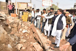 Minister Ramesh Meena met family of deceased woman in Karauli