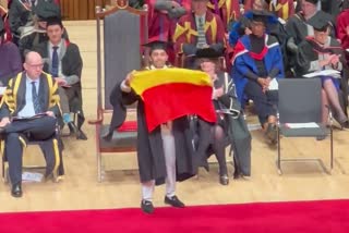 a-student-shows-kannada-flag-while-he-receiving-his-ms-degree-in-london