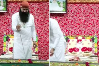 Ram Rahim cuts cake with a sword