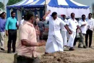 Tamil Nadu Minister SM Nasar throws a stone at party workers