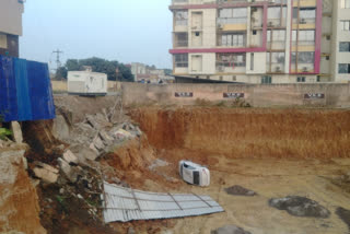 crack-in-apartment-due-to-illegal-construction and soil erosionin car fell into hole -in jarkhand