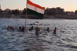 Flag hoisting done at sea in Porbandar