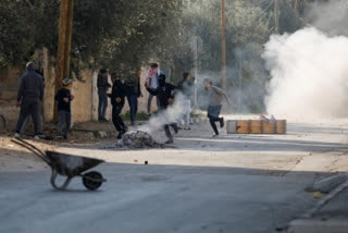 Palestinians: Israeli troops kill 10 in West Bank violence