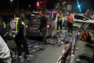 Israel's national rescue service Mada says a gunman killed five people and wounded three others in a shooting near a synagogue Friday night in east Jerusalem in one of the deadliest attacks on Israelis in years