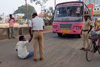 in Thanjavur youth staged a road blockade after the police fined him for not wearing a helmet