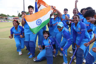 Women players waving tricolor after winning  the ICC Women's Under-19 T20 World Cup final match