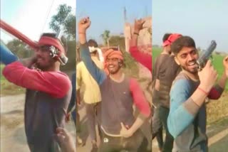 Youth dancing and firing with pistol in Buxar