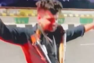 Video of dance with rifle on elevated road