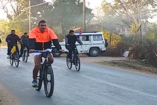 IG Badrinarayan Meena of Bilaspur Range riding a bicycle