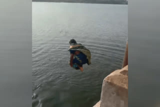 Saree-clad Women diving in river