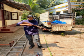 Veterinarian Dr Yashasvi Naravi checking out tranquillizer gun