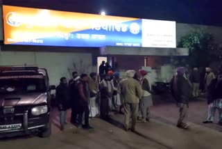 Villagers gathered in front of the police station