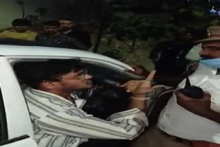 A young man fighting with the traffic police