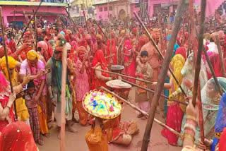 People smear in colors as they take part in 'Lathmar Holi' in Mathura