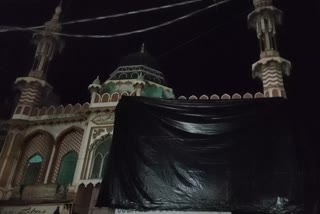 Aligarh mosque covered in tarp ahead of Holi