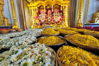 different colored flowers to Lord Jagannath