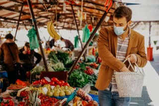 Young man shopping vegetables