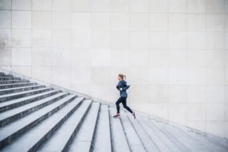 woman running up stair