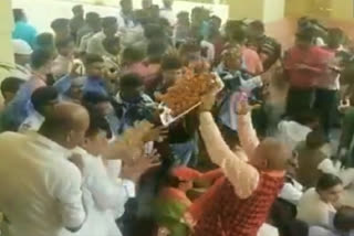 BJP MLA flung a tray full of laddus