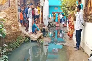 drain water flowing on road in patna