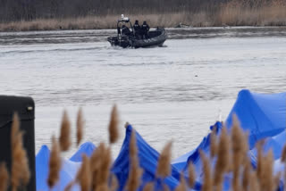 Authorities in the Mohawk Territory of Akwesasne said Friday one child is missing after the bodies of six migrants of Indian and Romanian descent were pulled from a river that straddles the Canada-U.S. border.