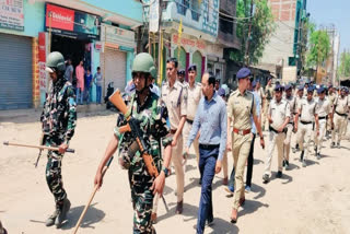 Nalanda police and paramilitary forces conduct a flag march on Wednesday