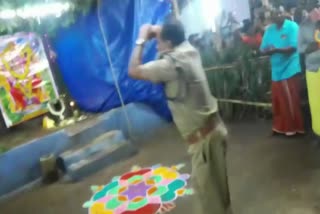 Kerala police officer dances in front of temple