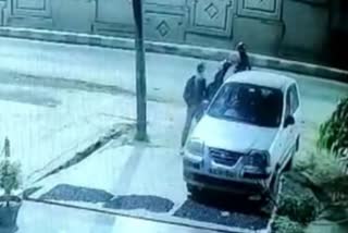 thief running away after stealing car