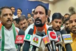 Congress candidate Laxman Savadi spoke to reporters.