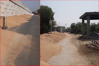 farmers putting wheat in crematorium