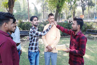 Supporters offering sweets to former MLA Rajesh Mishra