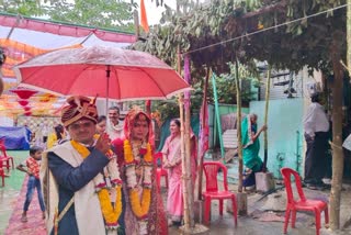 Bride and groom married with umbrella in Betul