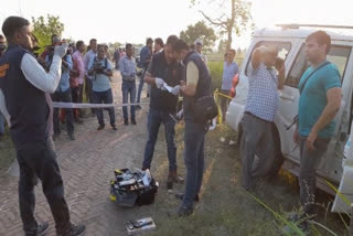 UP police lifting evidence from the spot in Meerut