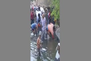 People In Canal To Collect Money