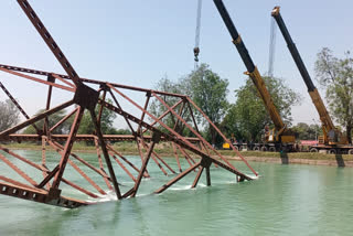 The bridge being built over the Bhakra Beas Canal in Rupnagar collapsed