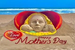 Sand artist Sudarsan Pattnaik carves sand sculpture to mark Mother's Day at Puri beach