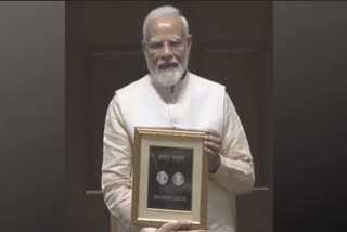 pm modi releases special commemorative postage stamp rs 75 coin