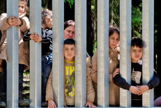 Migrants with children stuck at Poland's border wall; activists say Belarus won't let them turn back