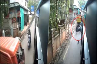 Girls amazingly escapes  caught in between bus and the tipper lorry  bus and the tipper lorry  Girls tries to Overtaking to board into bus  Kozhikode  Escaped Amazingly  amazing escapes  ബസില്‍ കയറാനായി സ്‌കൂട്ടറില്‍ ഓവര്‍ടേക്ക്  ബസിനും ടിപ്പർ ലോറിക്കുമിടയിൽ  പെൺകുട്ടികള്‍  പെൺകുട്ടികള്‍ രക്ഷപ്പെട്ടത് അത്ഭുകരമായി  സ്വകാര്യ ബസിനും ടിപ്പർ ലോറിക്കുമിടയിൽ  ബസിൻ്റെ ക്യാമറ  ഹെൽമെറ്റ്  ട്രാഫിക് നിയമങ്ങൾ  മോട്ടോർ വാഹന വകുപ്പ്